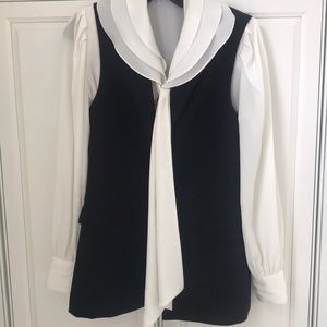 Off white synthetic fabric blouse.